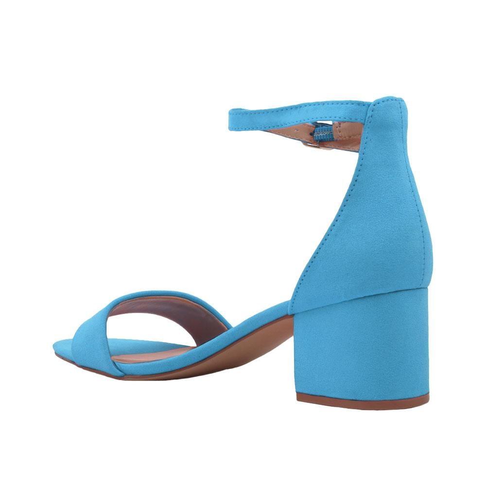 Heel flats in turquoise-colored with a buckle ankle clasp and strapped open toe-posterior view