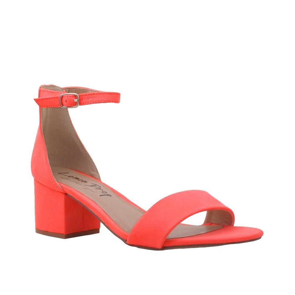 Orange-colored heel flats with a buckle ankle closure and a strapped open toe-corner view