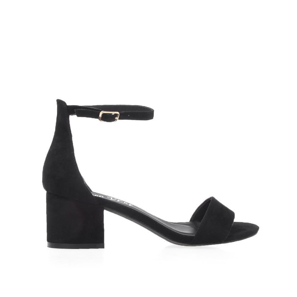 Plain black heel flats with a buckle ankle closure and a strapped open toe-side view