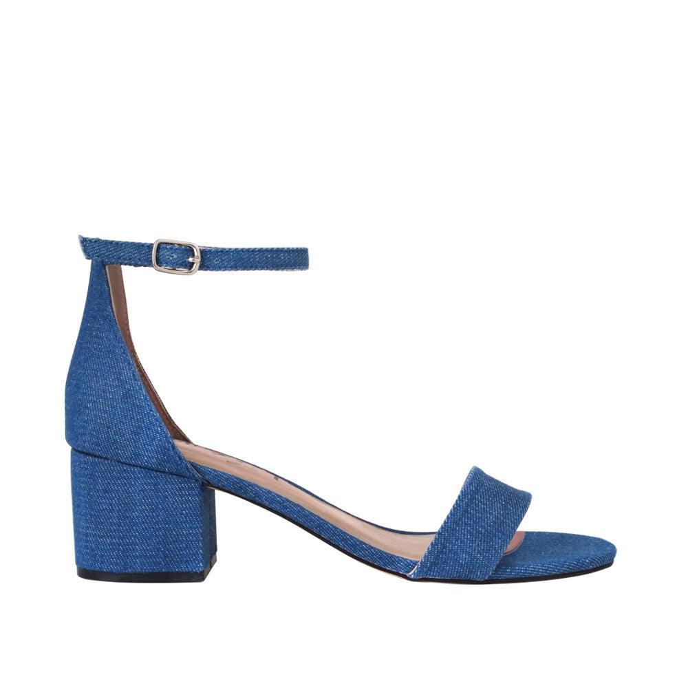 Heel flats in denim-color with a buckle ankle closure and a strapped open toe-side view