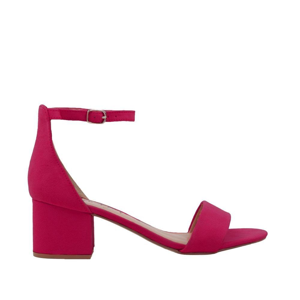 Fuchsia-colored heel flats with a buckle ankle closure and a strapped open toe-side view