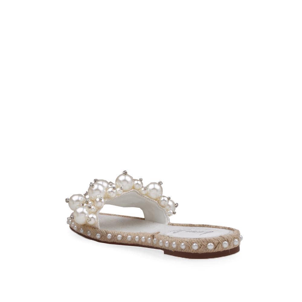 White women flats with pearl embellished upper and jute base lining-corner view