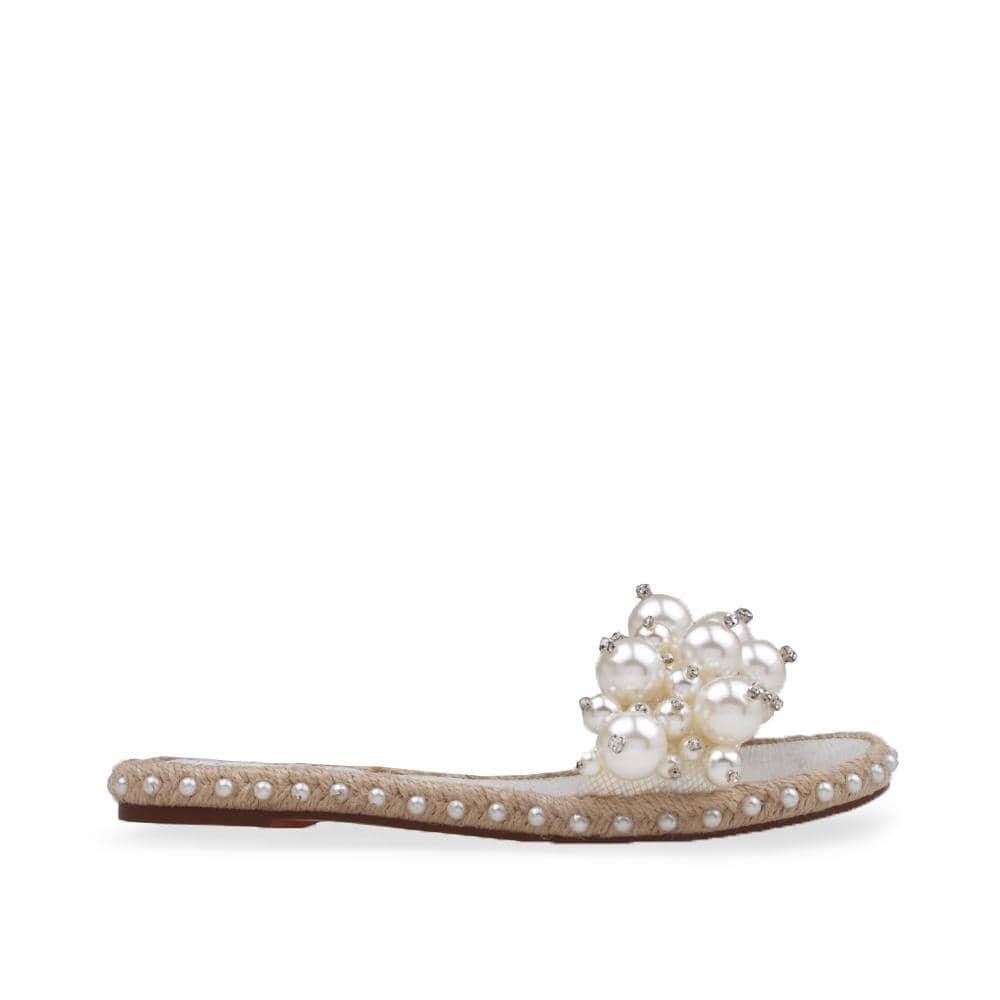 White women flats with pearl embellished upper and jute base lining-side view