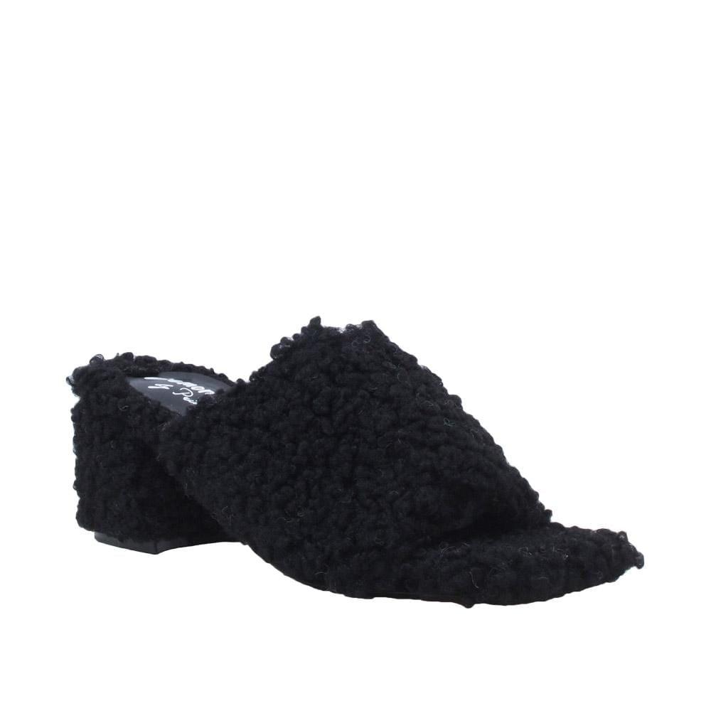 Black colored women flats covered with faux fur-corner view