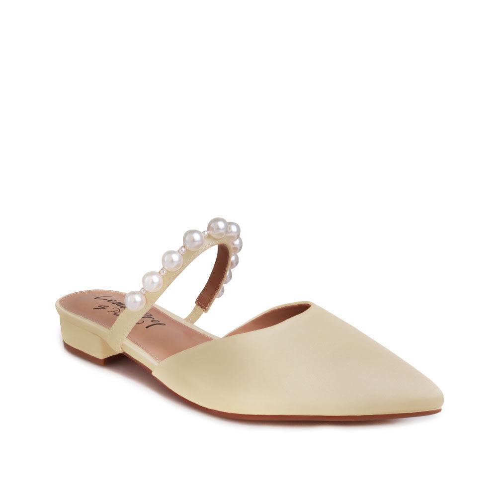 Women's slip ons in champagne with white pearls strap-corner view