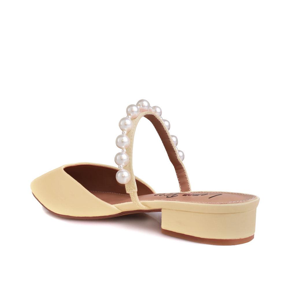 Women's slip ons in champagne with white pearls strap-posterior view