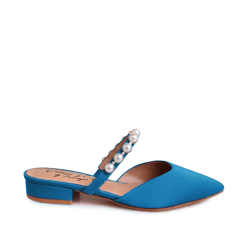 Women's slip ons in turquoise with white pearls strap-side view