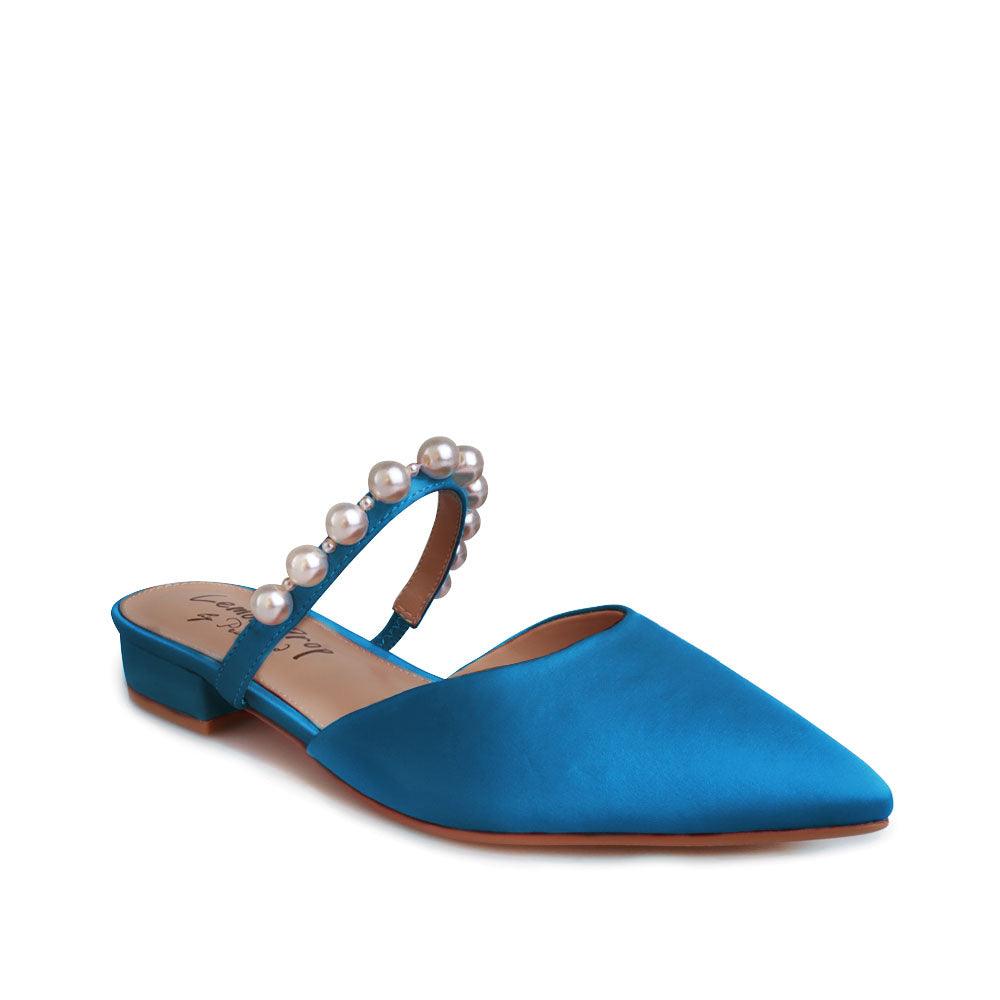 Women's slip ons in turquoise with white pearls strap-corner view