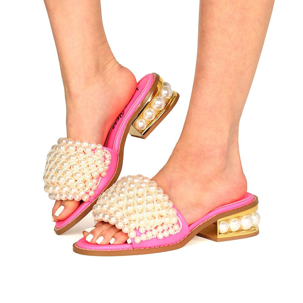 Pink women heels with pearl embellishments on upper and heel