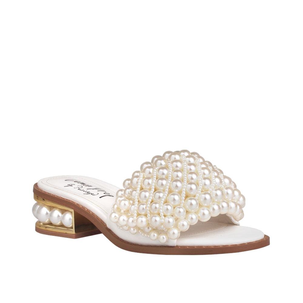 White women heels with pearl embellishments on upper and heel-corner view