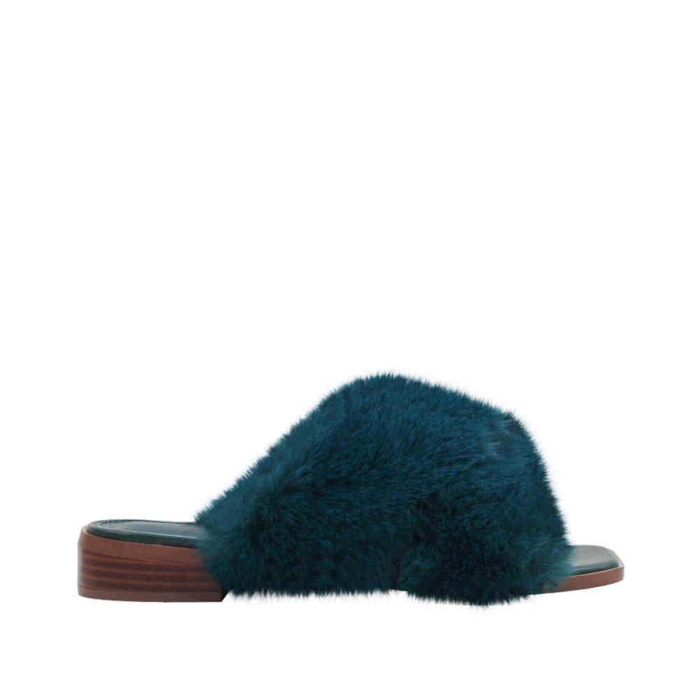 Women slip ons with faux fur accents in teal