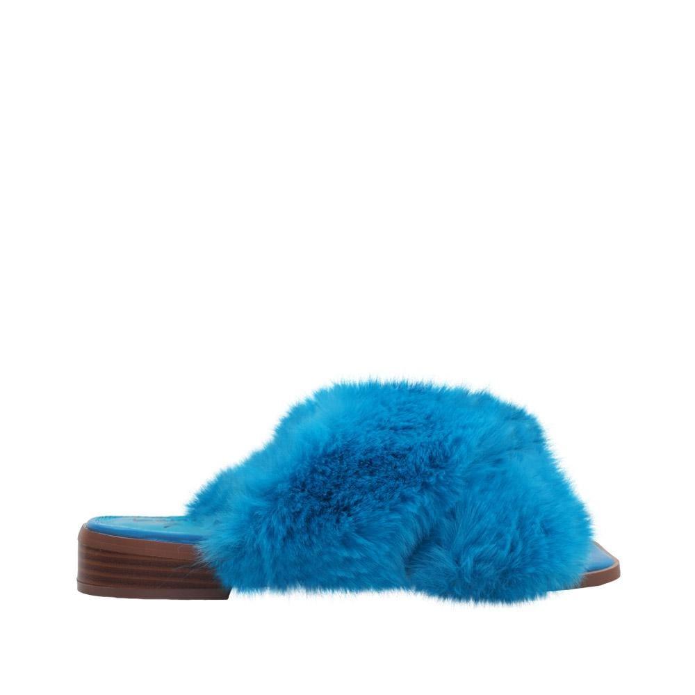 Women slip ons with faux fur accents in turquoise