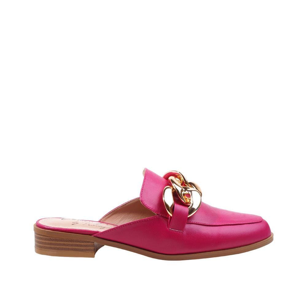 Fuchsia flats with gold chain upper and slip-on design.