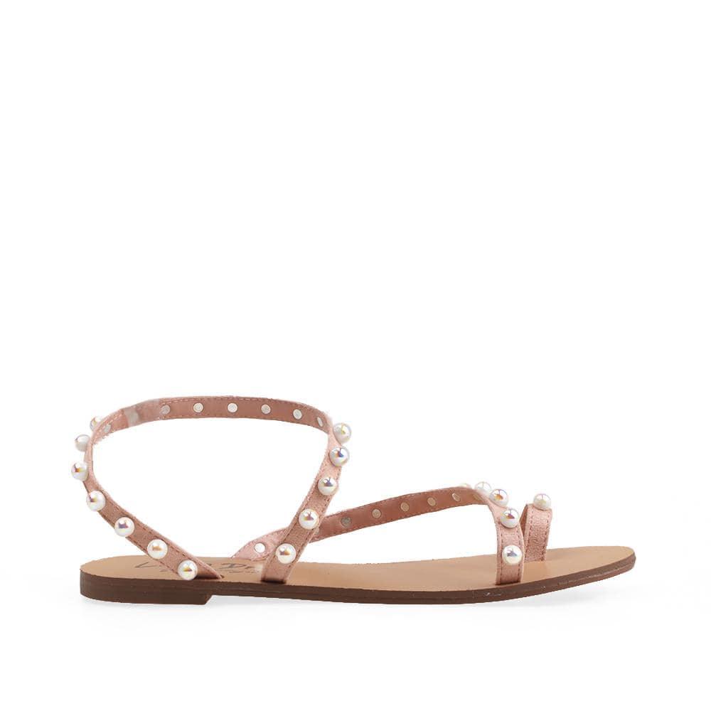 Flats in nude with a pearl embedded strap style