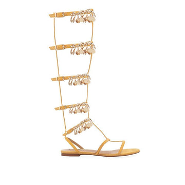 Knee high women's sandals with gold metallic chain and rhinestone accents in cognac-side view