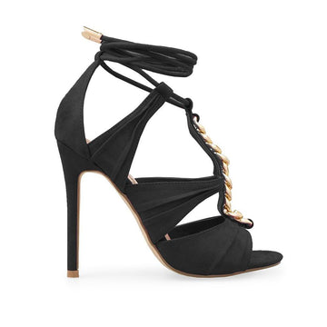 Black colored heels with metallic chain upper and ankle tie closure
