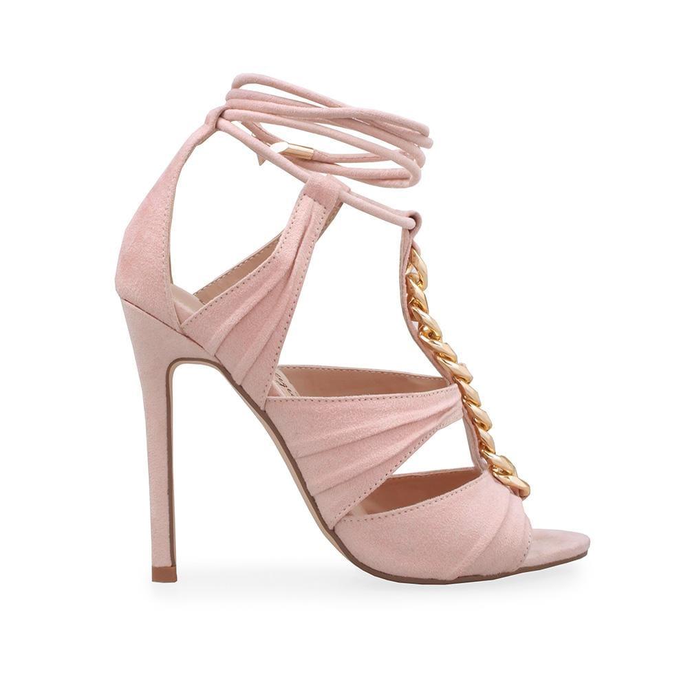 Heels in nude with a metallic chain top and an ankle tie clasp.