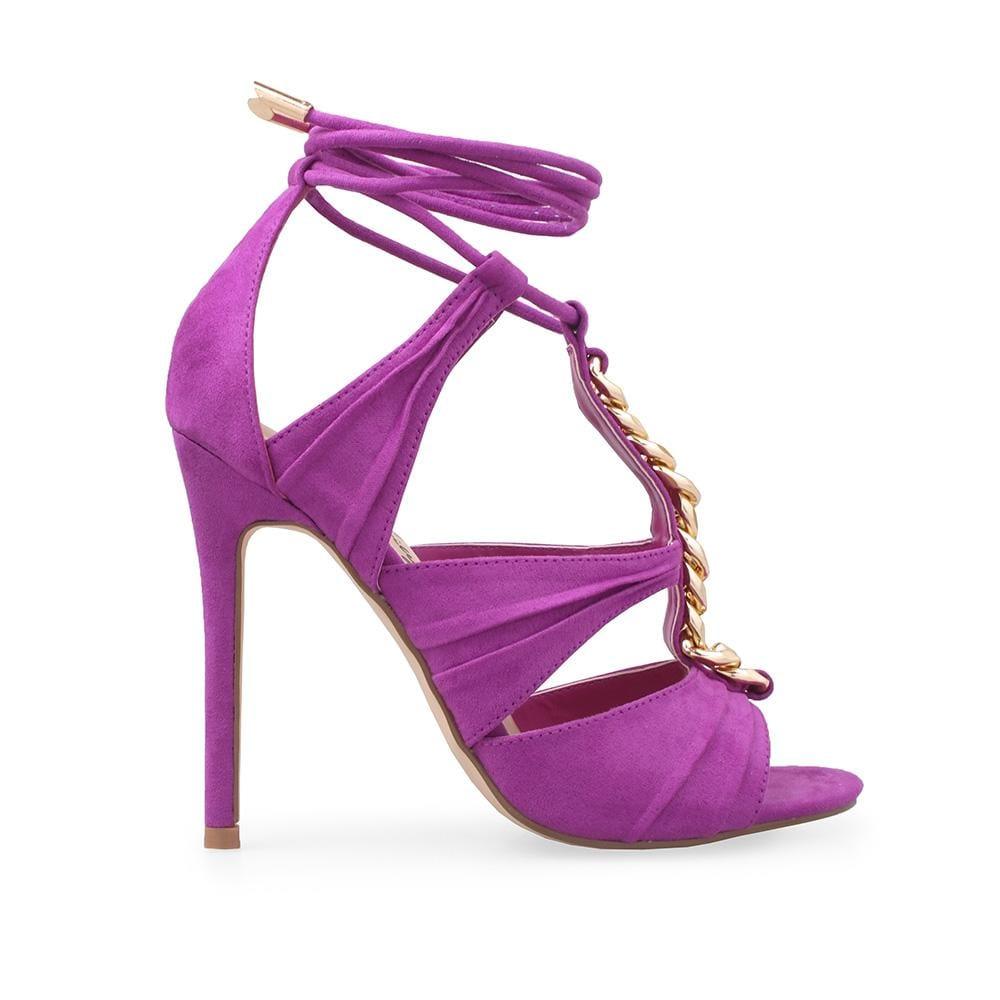 Purple heels with a golden chain top and ankle tie clasp.