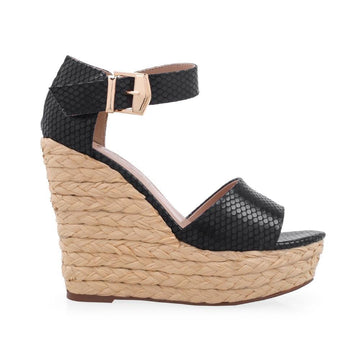 Nude colored platform with black snake design upper and ankle buckle clasp