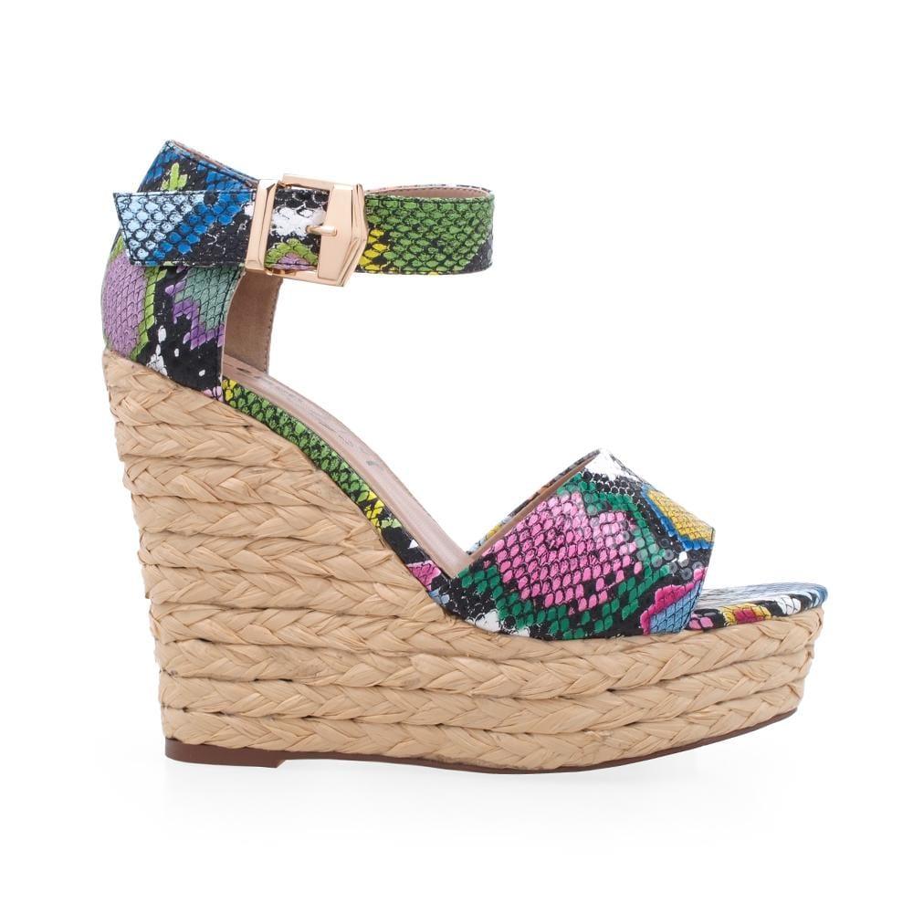 Platform with multi-snake pattern upper and an ankle buckle clasp.