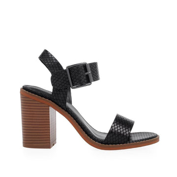 Women block heels in brown color with black snake skin upper and ankle buckle closure 
