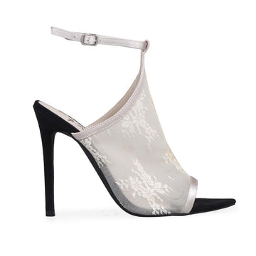 Black-colored women's heels with white floral design top strap and ankle buckle clasp