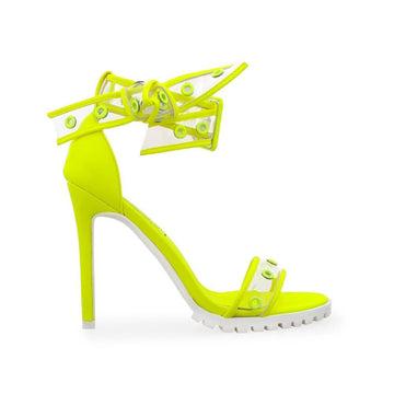 Neon yellow women's heels with clear vinyl ankle straps-side view