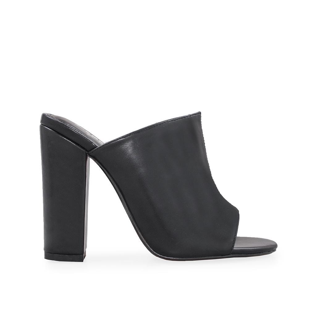 Clear vinyl and faux black leather upper women's block heel-side view