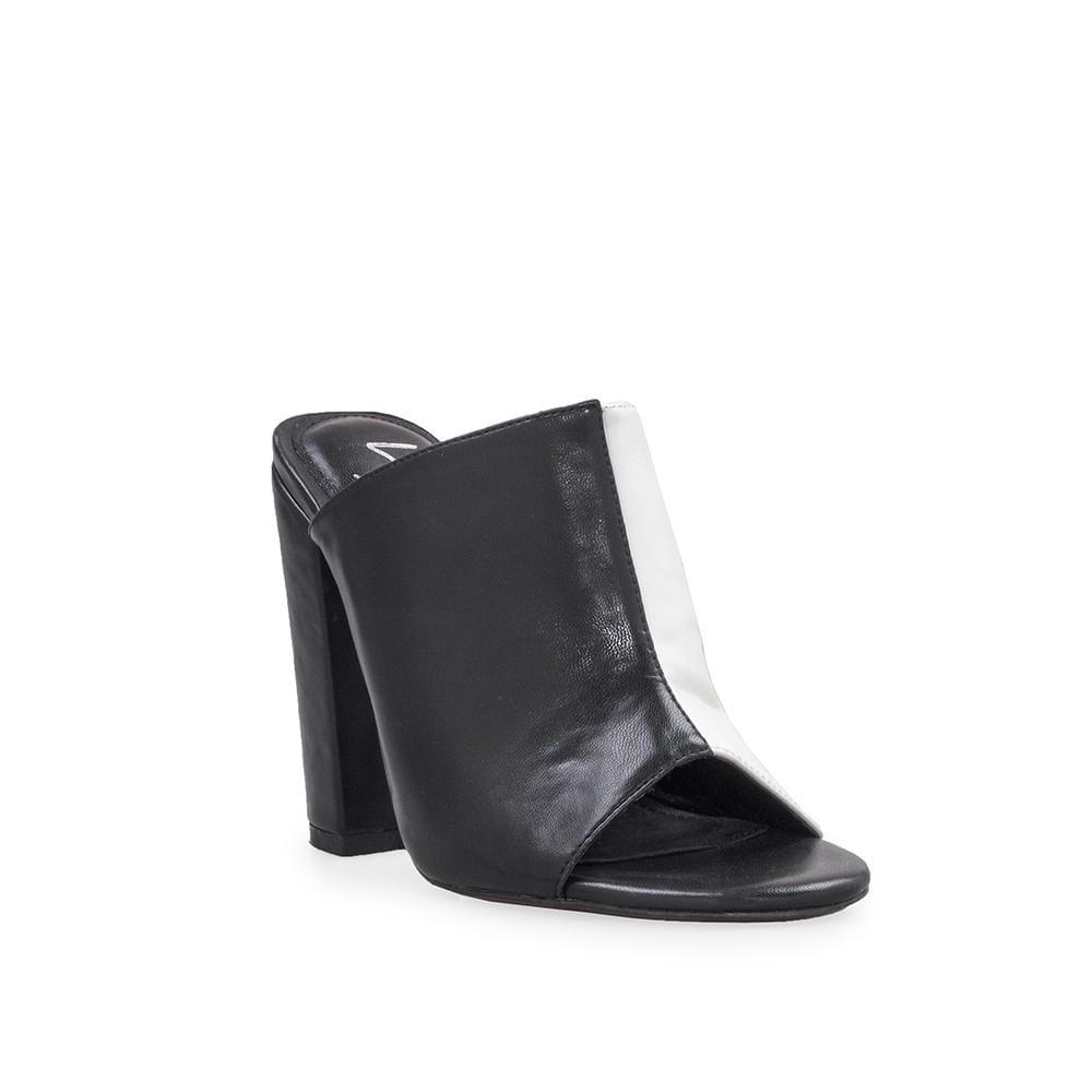 Clear vinyl and faux black leather upper women's block heel-corner view