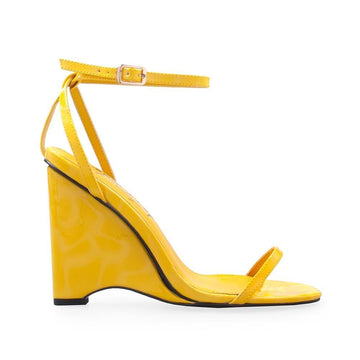 Vegan patent leather women's wedge heel in yellow-side view