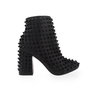 Spike studded women's block heel in black-side view