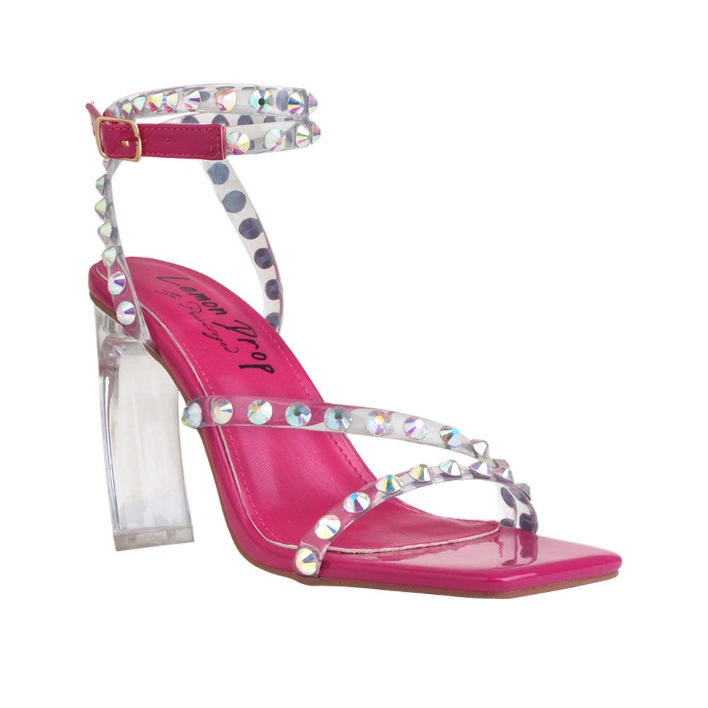 Open-toed heels in fuchsia color with beaded ankle straps and a buckle - corner view