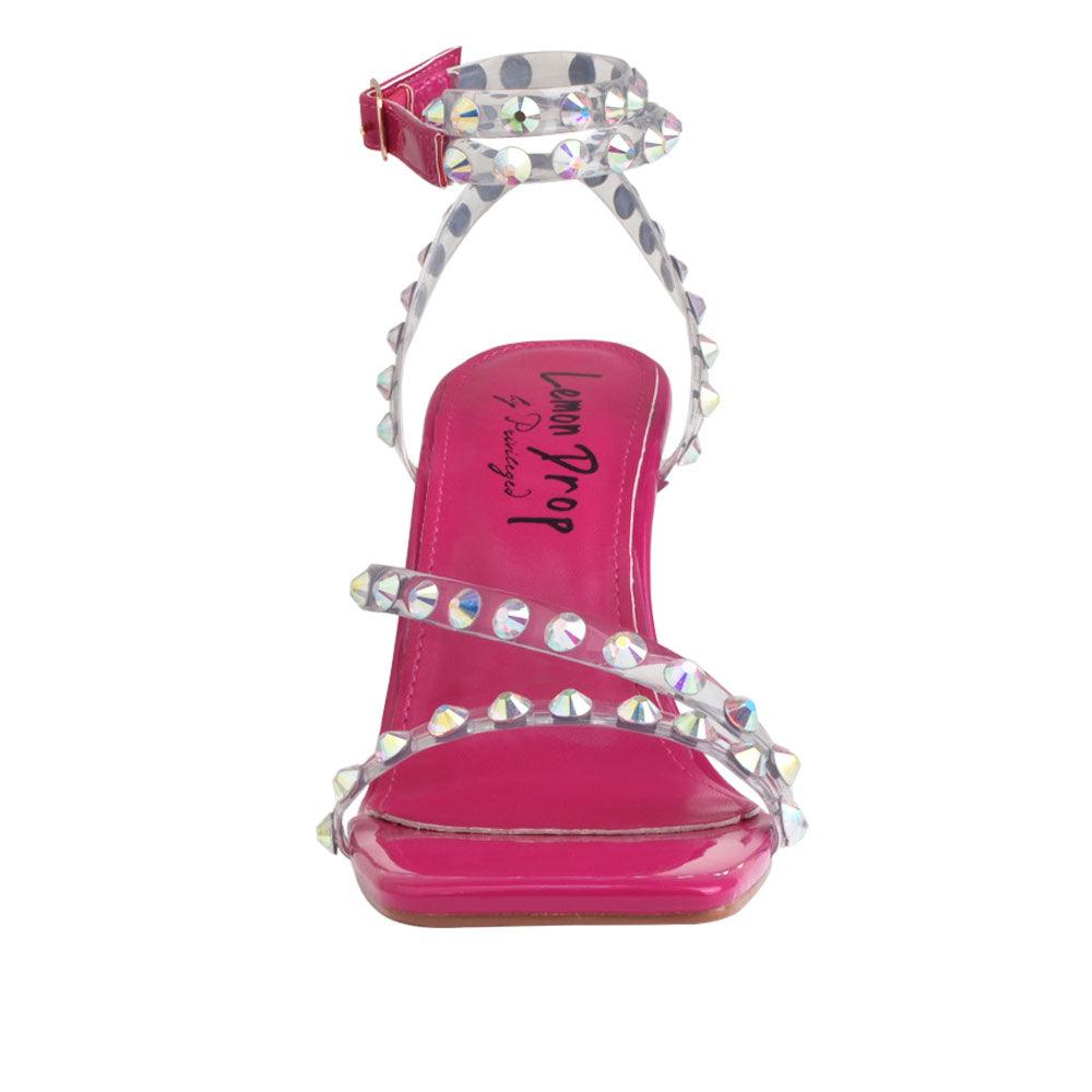 Open-toed heels in fuchsia color with beaded ankle straps and a buckle - front view