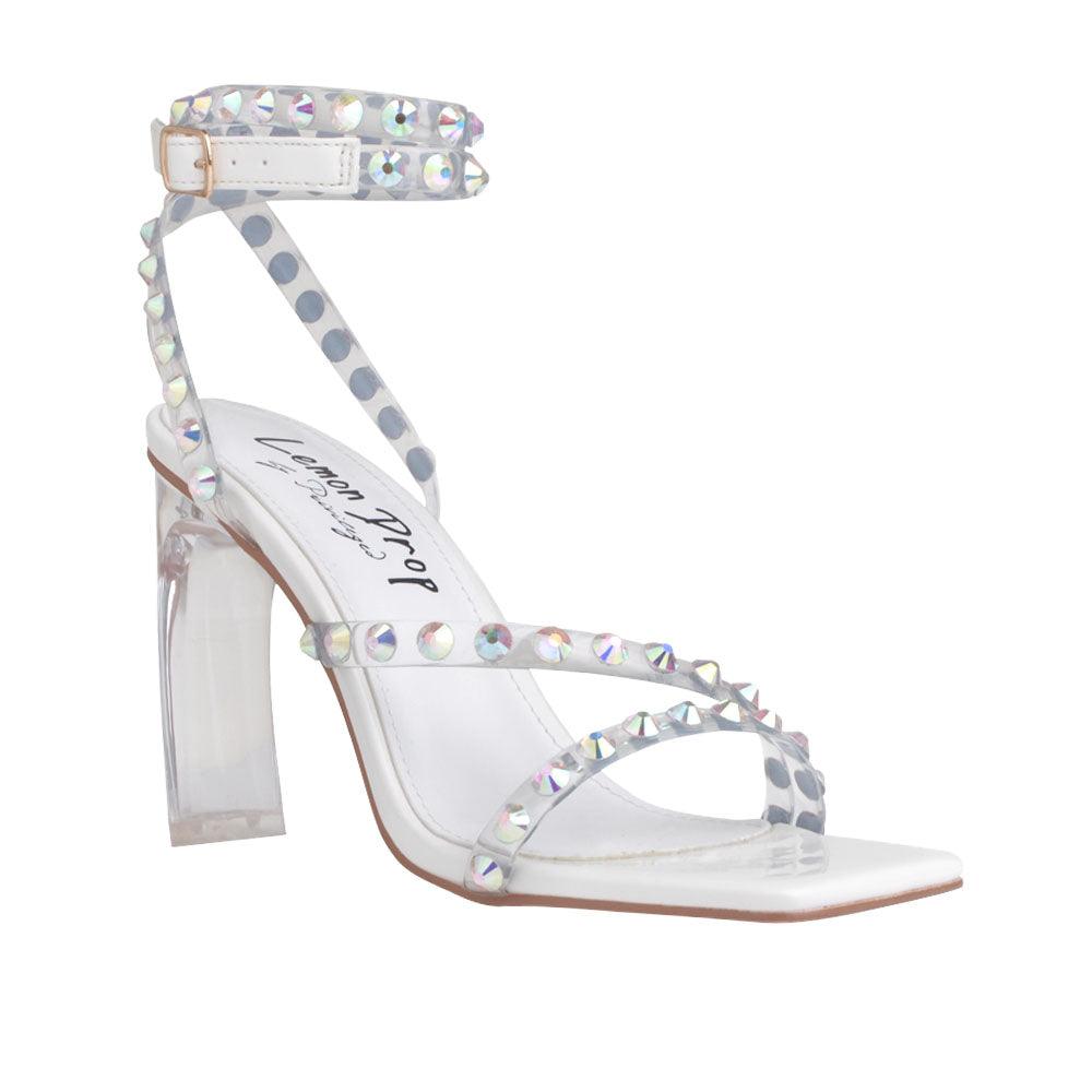 white colored heels with an open toe, beaded ankle straps, and buckle - corner view