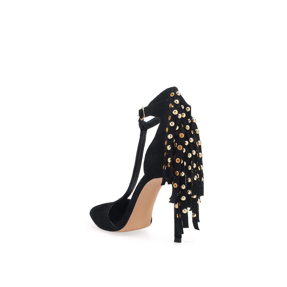 Plain black t-strap heels with metallic gold studs behind the buckle-posterior view