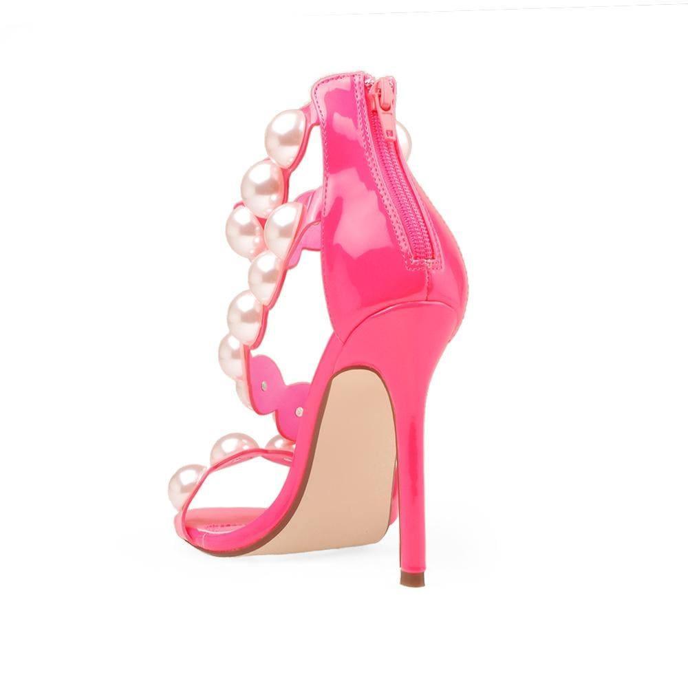 Pink Women Heels with a large pearls design on the strap - posterior view