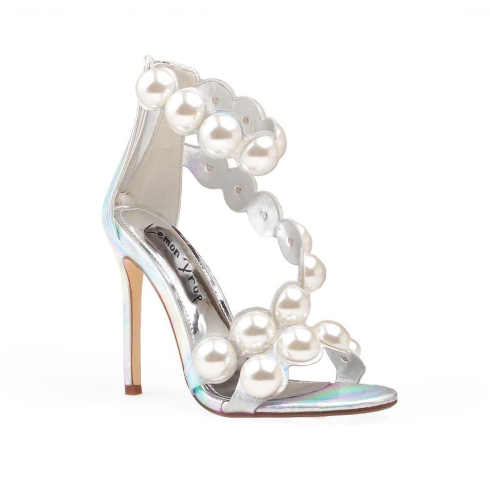 Women's silver colored heels with a back zipper and a strap design made of large pearls - corner view