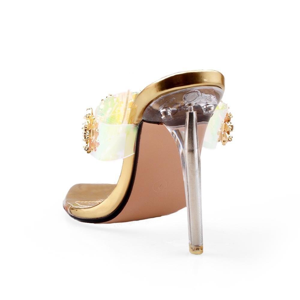 Golden women's heels with a multicolored strap and gleaming gemstone-posterior view