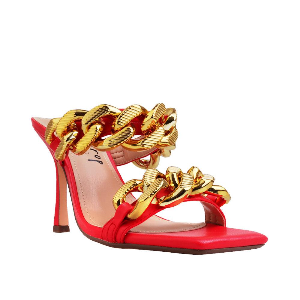 Women's red high heels with a gold dual chained strap-corner view