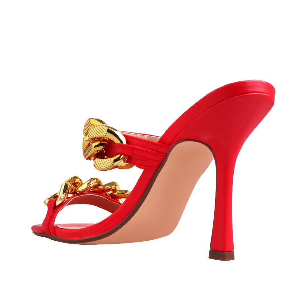 Women's red high heels with a gold dual chained strap-posterior view