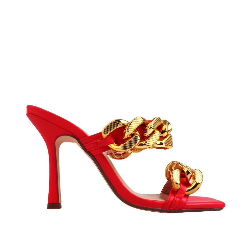 Women's red high heels with a gold dual chained strap-side view