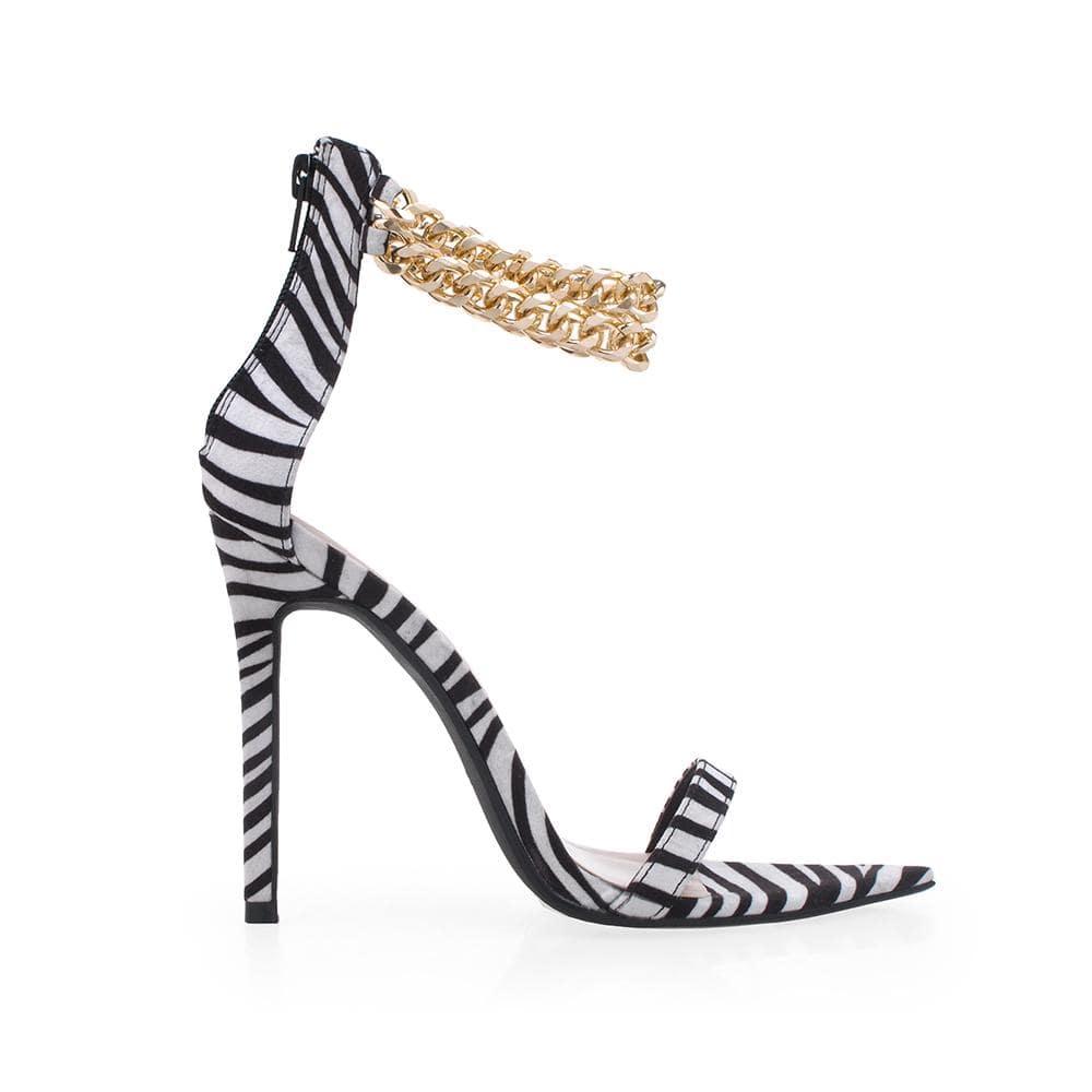 Open-toed zebra-pattern heel with a double metallic chain and a back zipper.