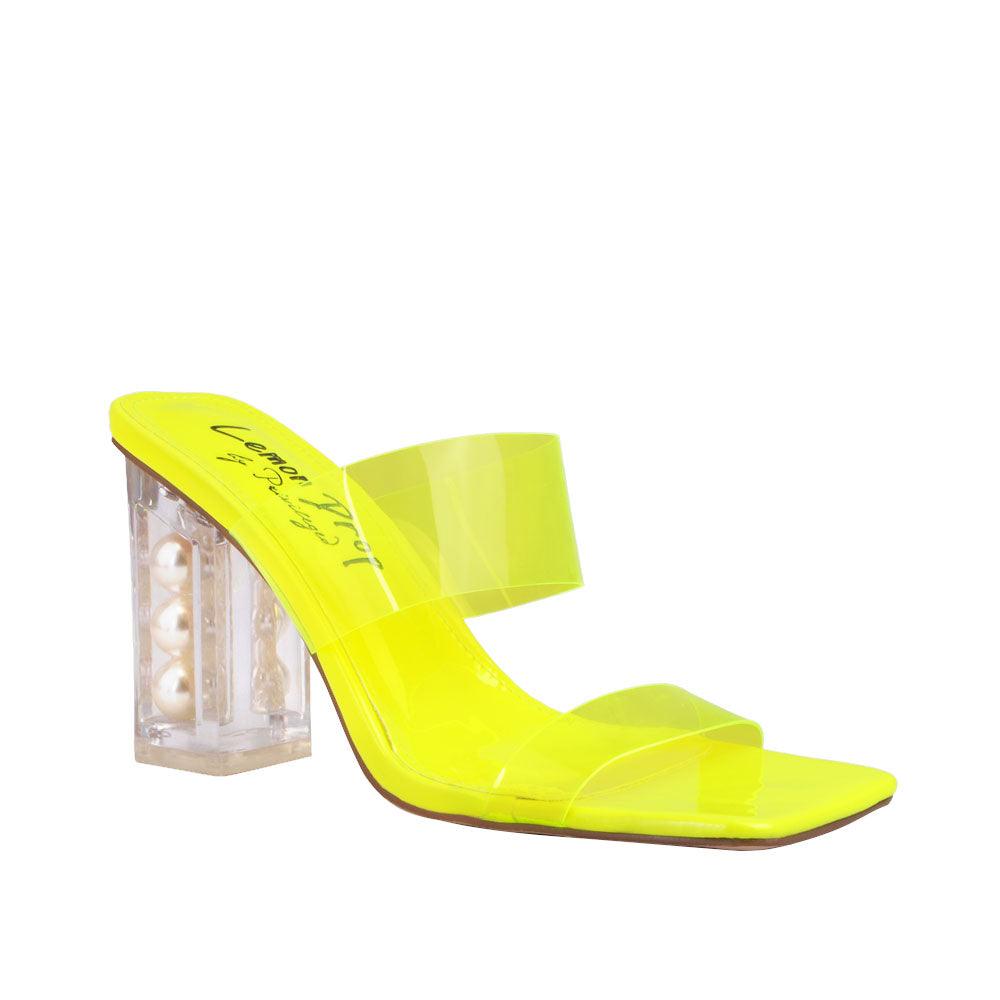 Neon yellow upper with block heels and see through trap-corner view