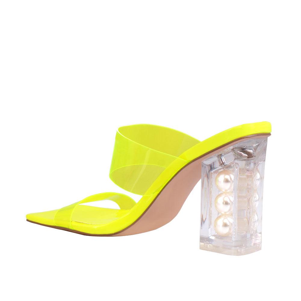 Neon yellow upper with block heels and see through trap-posterior view