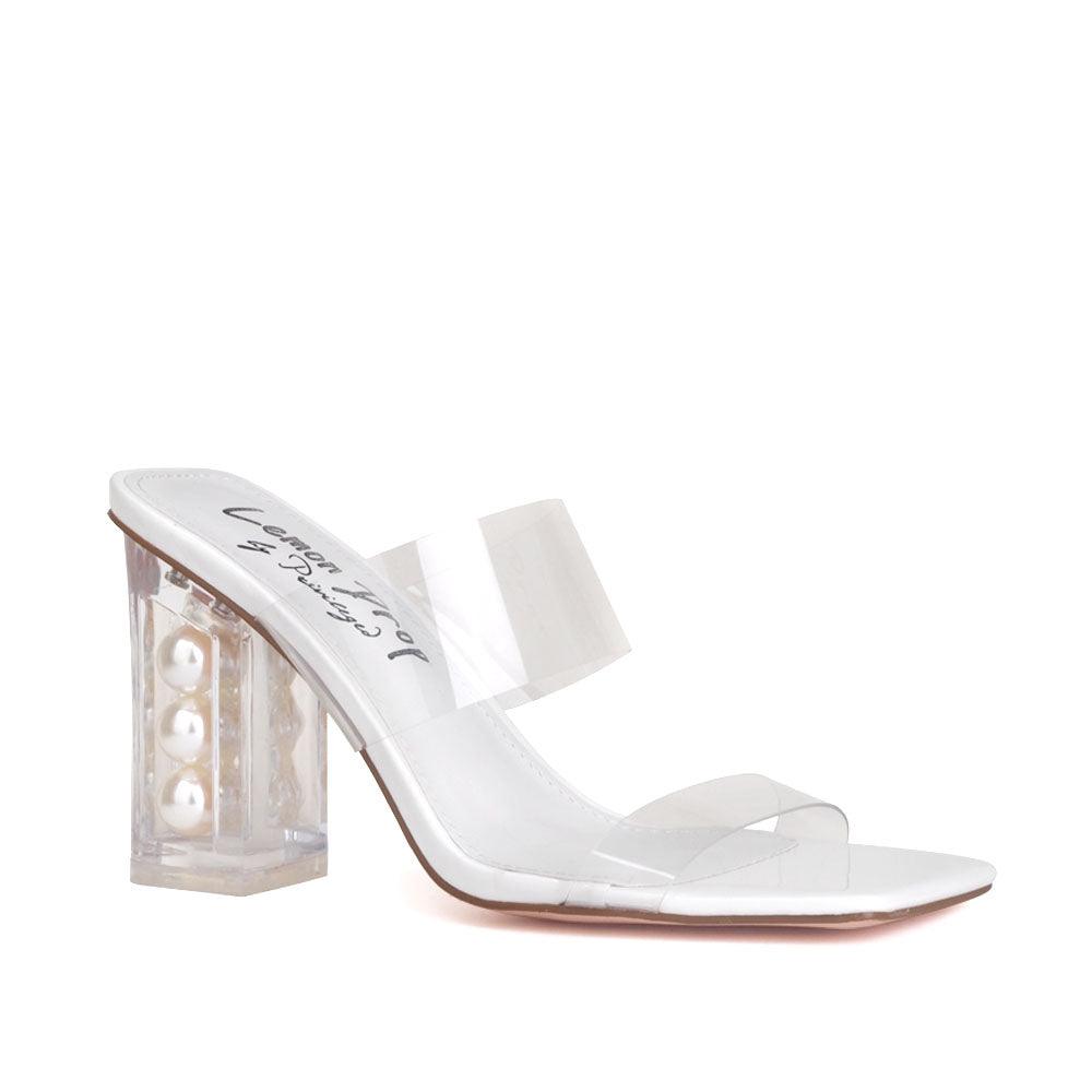 Clear block heels with a white upper and clear strap-corner view