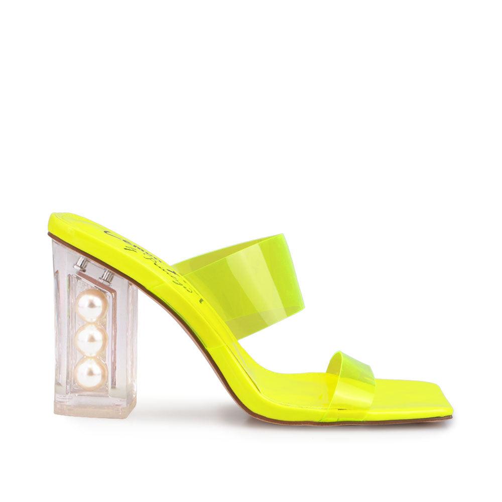 Neon yellow upper with block heels and see through trap-side view