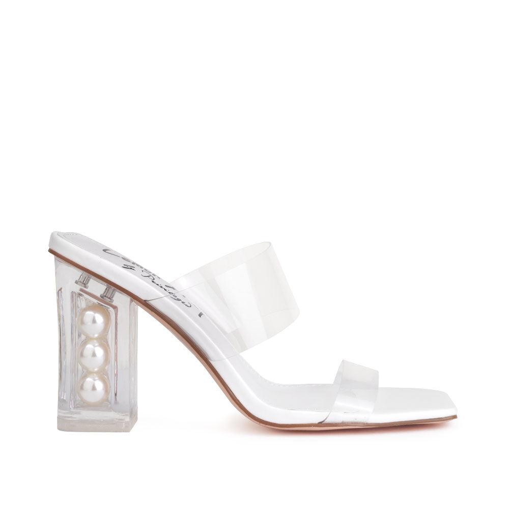 Clear block heels with a white upper and clear strap-side view