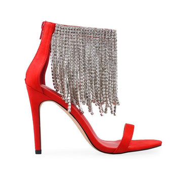 Red-colored women's heels with silver rhinestone studded tassels and ankle buckle