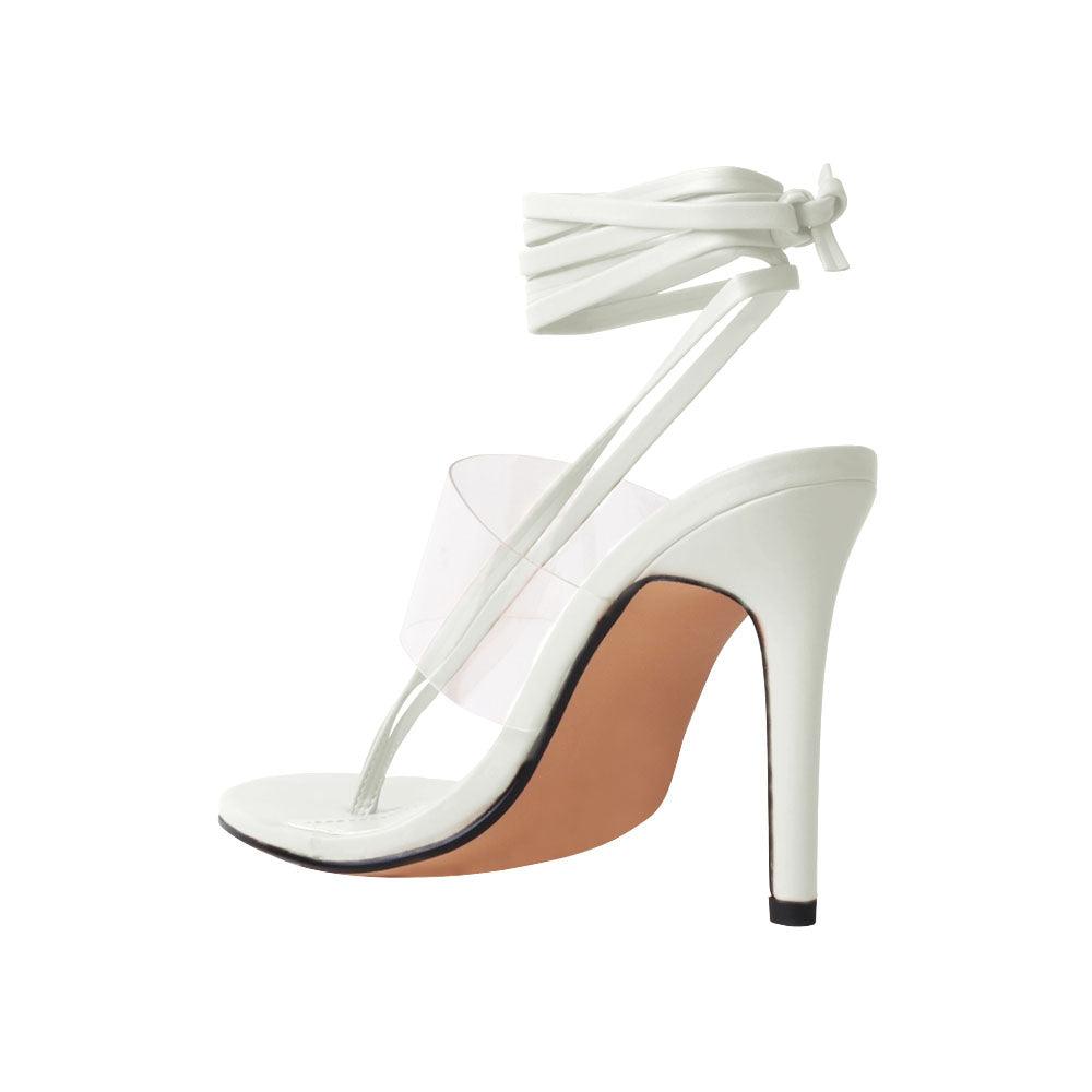 Women's white heels with lace lock up clasp and clear strap-posterior view