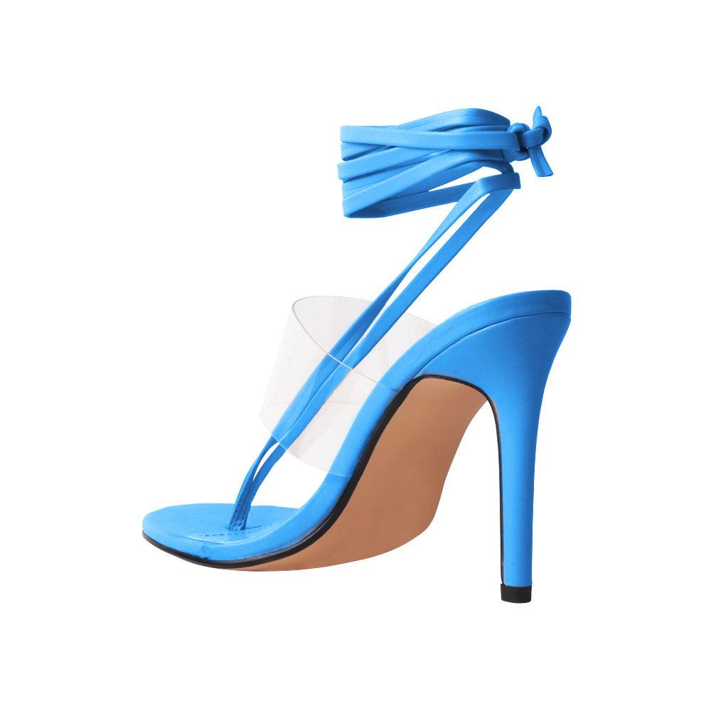 Women's turquoise-colored heels with a transparent strap and lace up clasp-posterior view